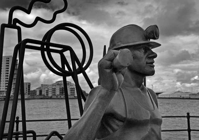 Image of a statue of a mine worker in black and white